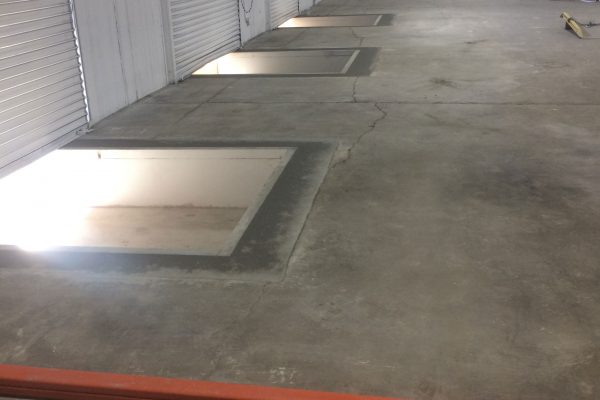 shut loading bay garage doors view from inside warehouse